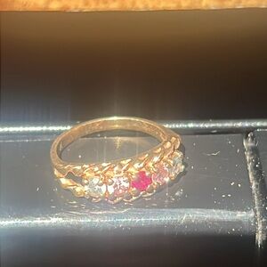 10k gold ring with aquamarine, pink topaz, and a ruby